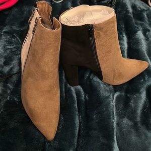 Haute ankle boot.  Two-toned tan/black with zippers.  Super cute.